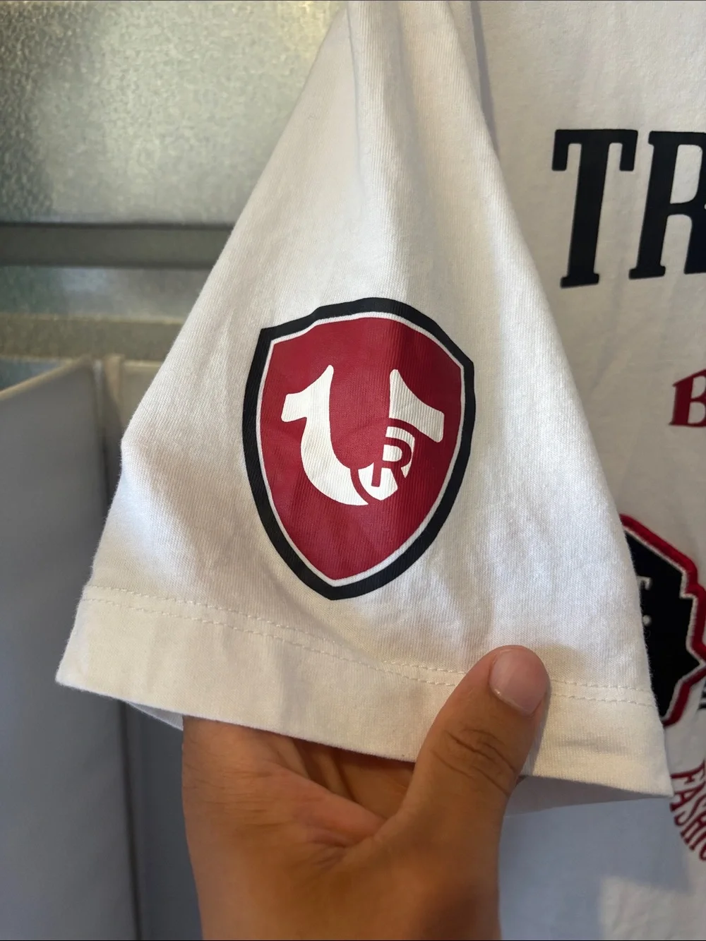 True Religion White T‑Shirt with Black Logo and Red Sleeve Patch